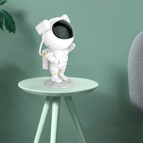 Side view of astronaut galaxy projector nightlight lamp