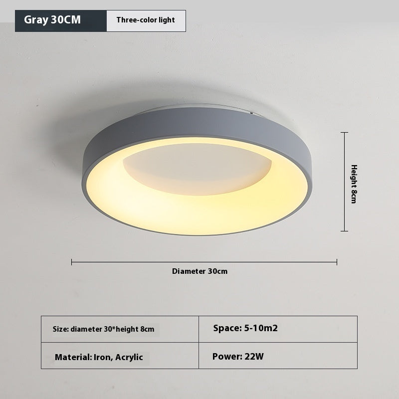 Acrylic shade on the bedroom ceiling lamp diffusing soft even light across the room

