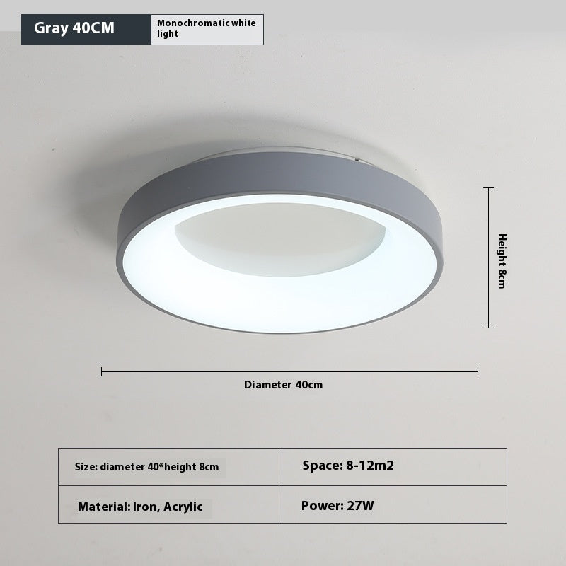 Translucent acrylic shade on the bedroom ceiling lamp lit up showing diffused light output
