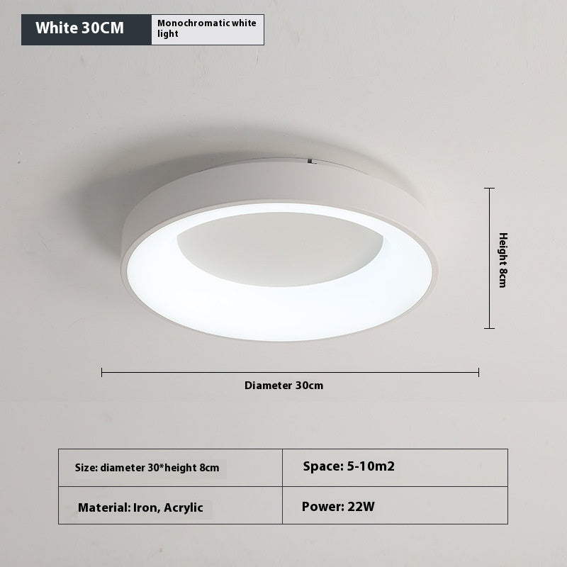 Bedroom ceiling lamp glowing with warm soft light in a dark master bedroom at night
