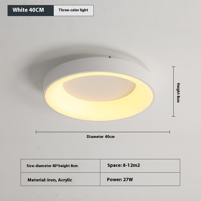 Acrylic shade being attached to the iron base during bedroom ceiling lamp installation
