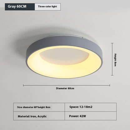 Modern minimalist ceiling lamp installed in a study room providing soft overhead lighting
