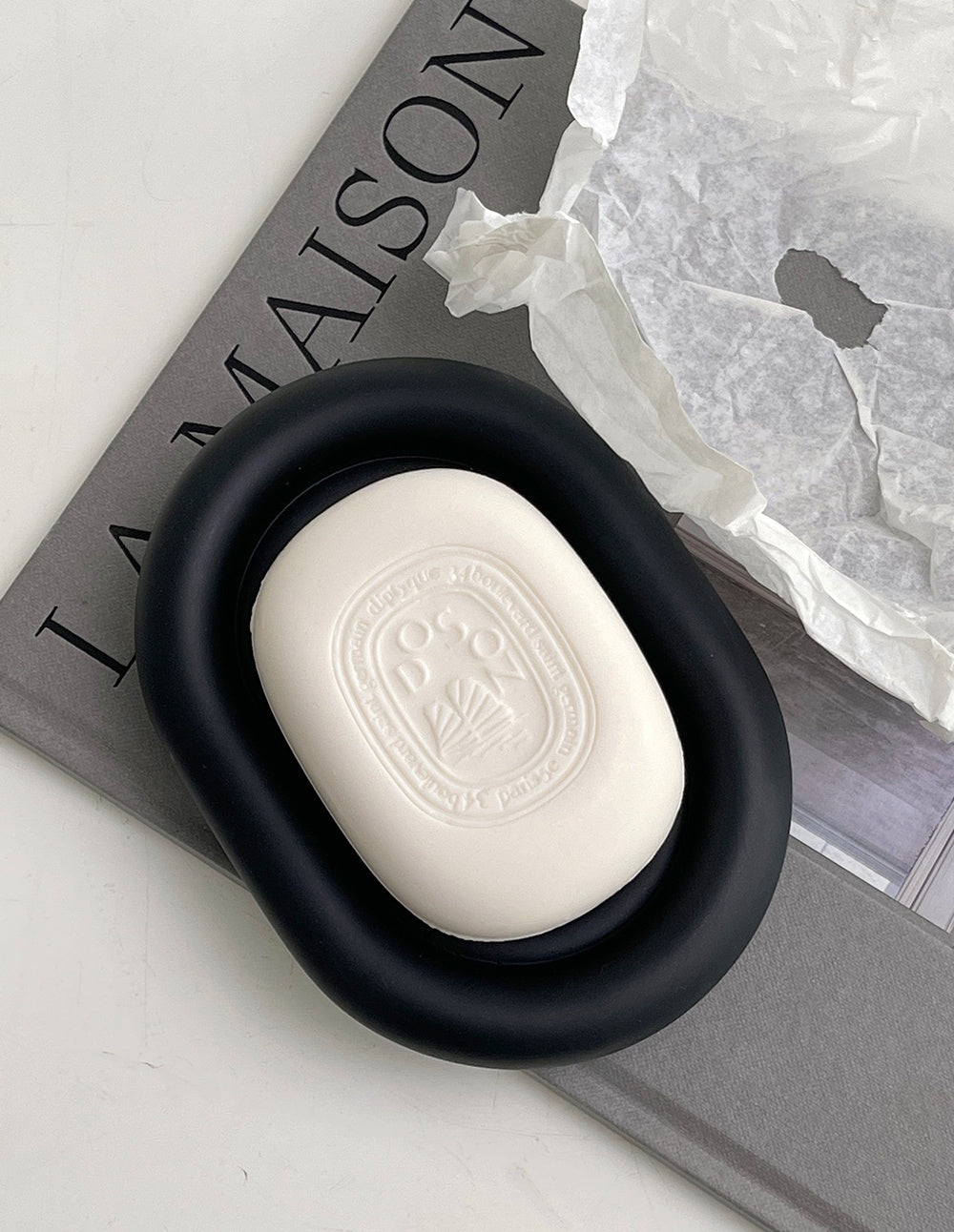 Matte black bathroom storage tray shown at 9.4x5.1 inch size beside a soap pump
