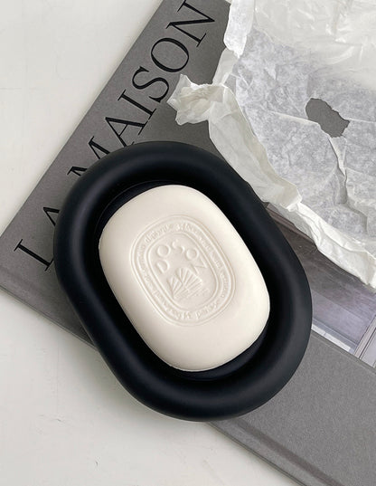 Matte black bathroom storage tray shown at 9.4x5.1 inch size beside a soap pump
