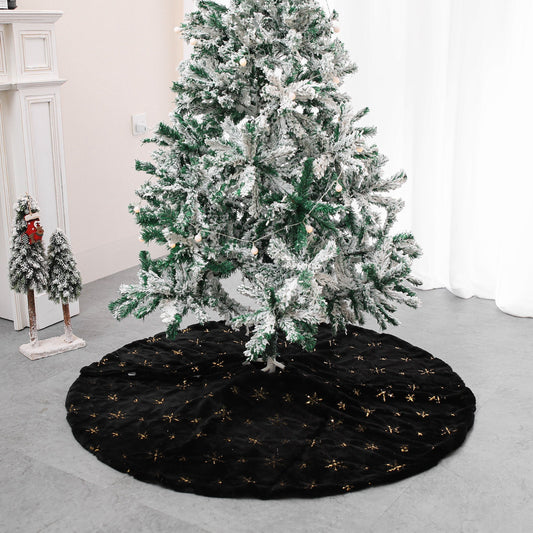Black velvet Christmas tree skirt with gold snowflake embroidery flat lay