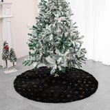 Black velvet Christmas tree skirt with gold snowflake embroidery flat lay