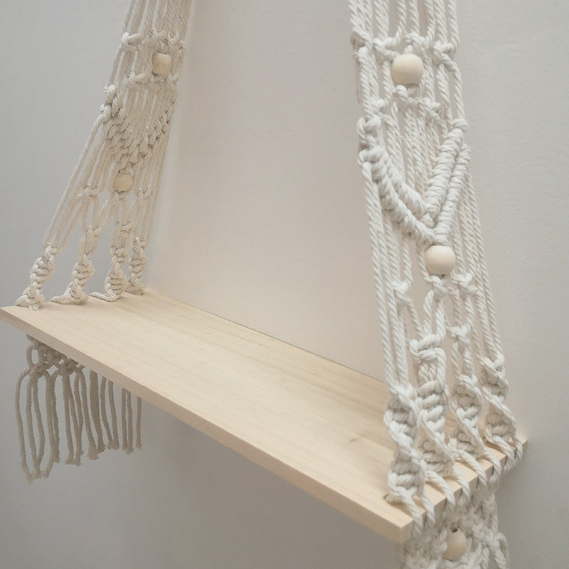 Close-up of the natural white check pattern woven into the bohemian cotton tapestry shelf