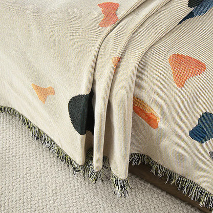 Boho fringe throw blanket cream abstract splash on bed bedroom decor
