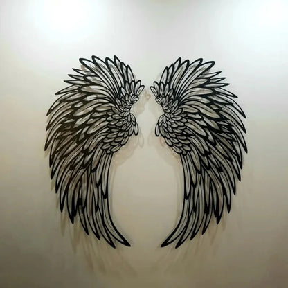 Close up of carved metal angel wings feather detail iron wall decor