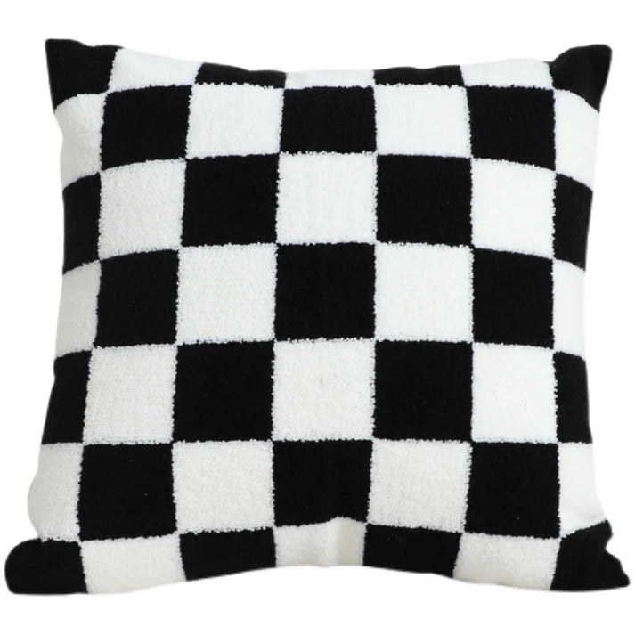 Close up of black and white checkered pattern on pillow