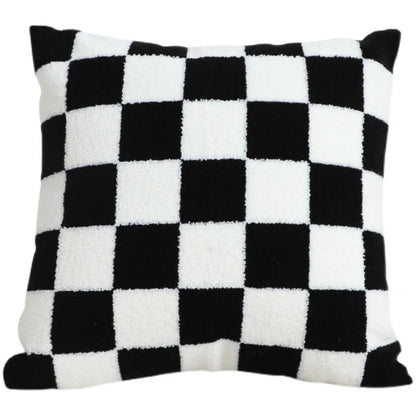Close up of black and white checkered pattern on pillow