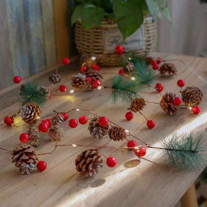 Pine cone string lights decorating bedroom wall for Christmas holiday season