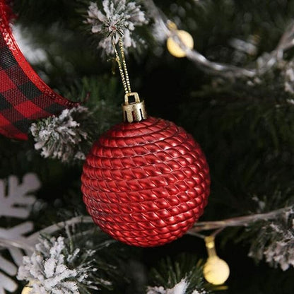 Close up of red ball ornament on Christmas tree