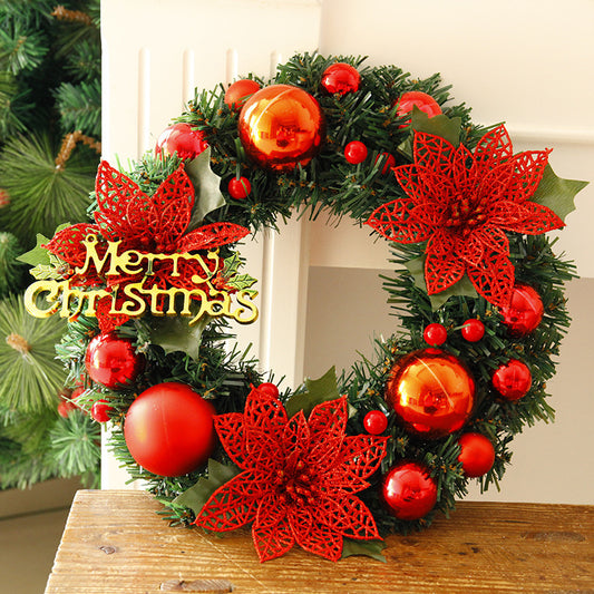 Green Christmas wreath decoration with multicolor ornaments close up