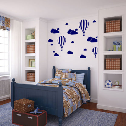 Hot air balloon cloud wall decals in modern living room with green chair