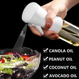 Continuous mist oil sprayer bottle spraying oil on baking tray