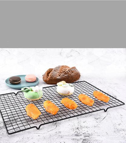 Cooling rack holding freshly baked cookies
