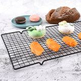 Carbon steel cooling rack holding pastries and baked goods