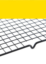 Cake cooling rack on yellow background showing full size