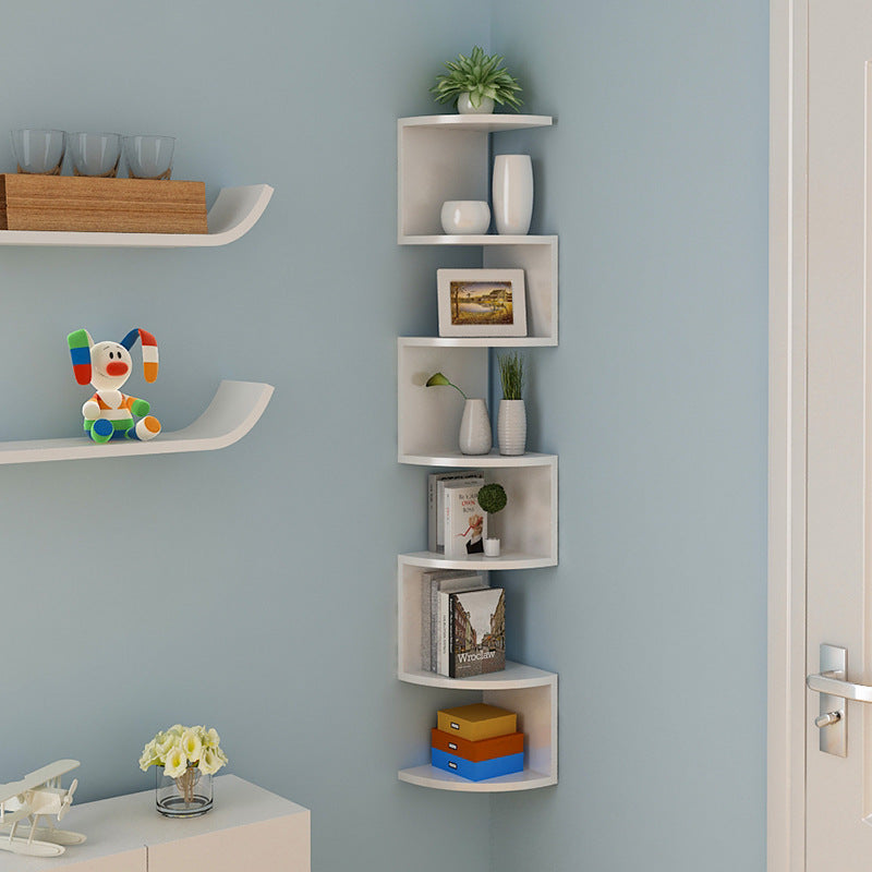 Light walnut corner wall shelf with 5 layers displayed in a warm-toned bedroom corner