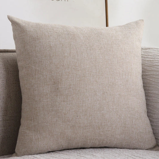 Beige cotton linen throw pillow on sofa