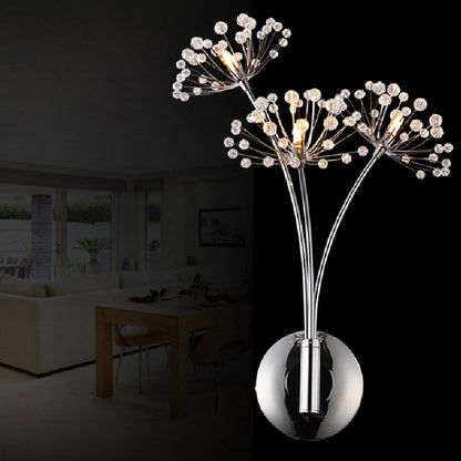 Crystal dandelion wall lamp lit with warm light