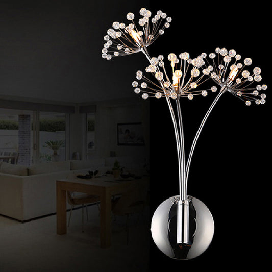 Crystal dandelion wall lamp lit with warm light