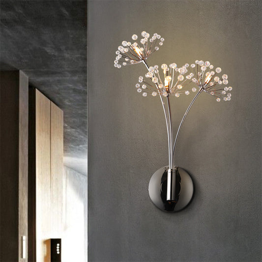 Crystal dandelion wall lamp glowing in dark hallway