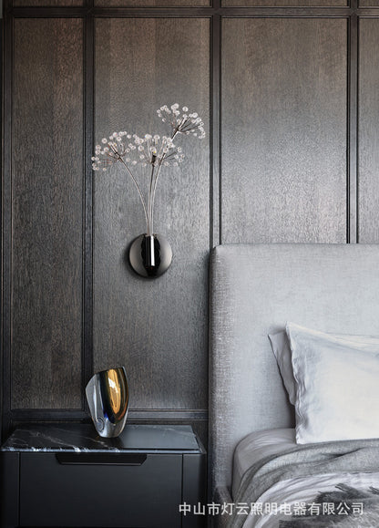 Crystal dandelion wall lamp mounted on gray wall
