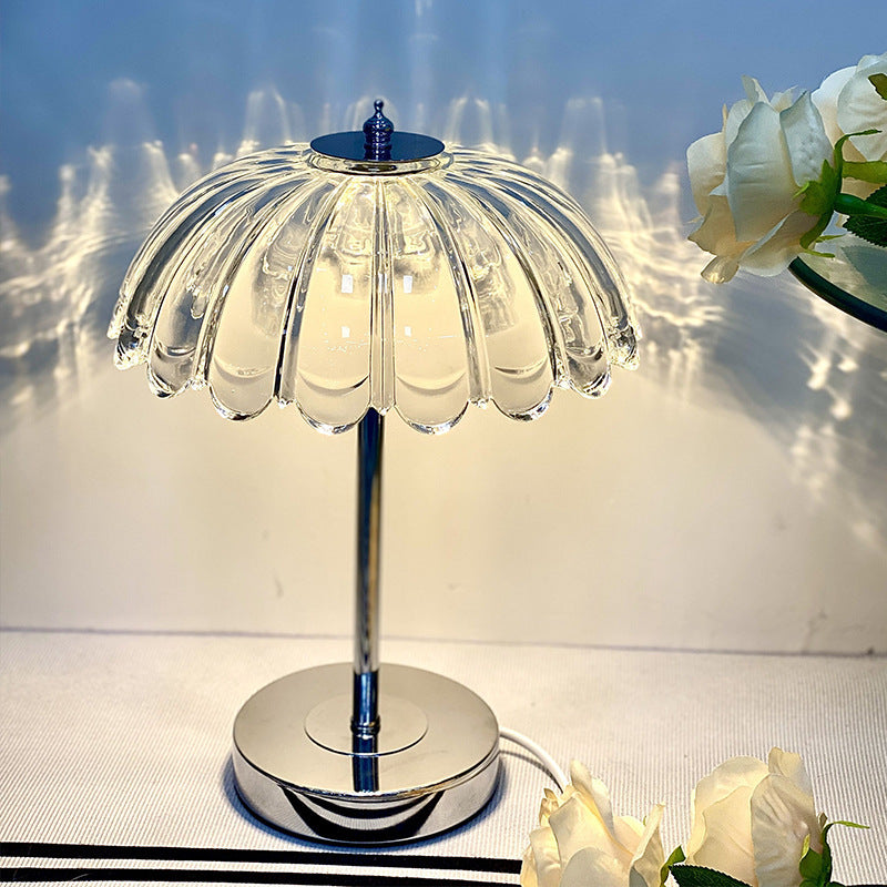 Crystal bedroom lamp in cool white light against a neutral wall