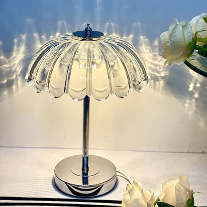 Crystal bedroom lamp in cool white light against a neutral wall