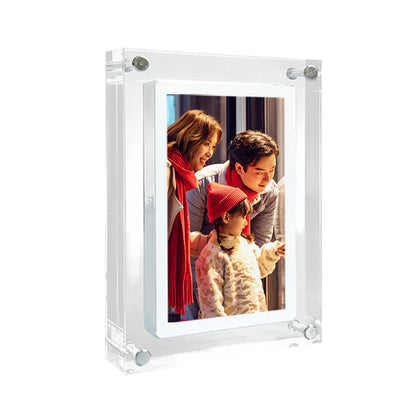 Digital photo frame displaying family portrait on desk