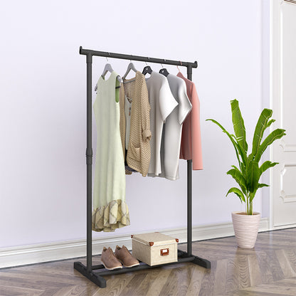 Close up of clothes hanging on floor drying rack rail