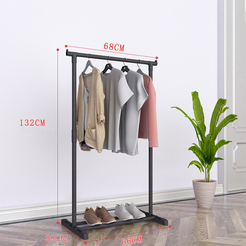 Floor drying rack styled with plant in living space