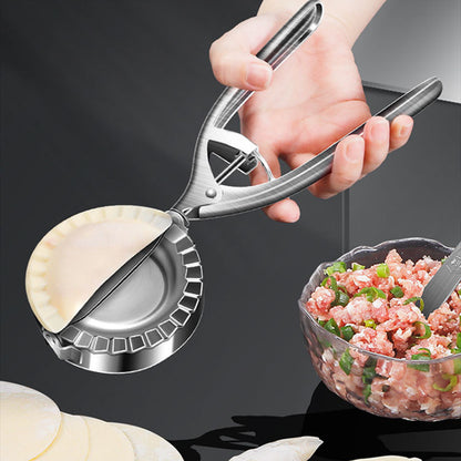 Compact stainless steel dumpling press showing hinged design