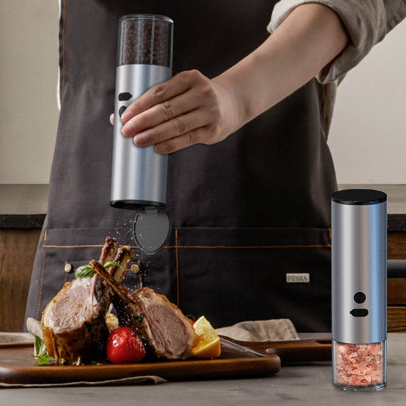 Electric pepper grinder showing LED light at base during use