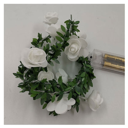 EVA white rose and green leaf LED string lights detail shot