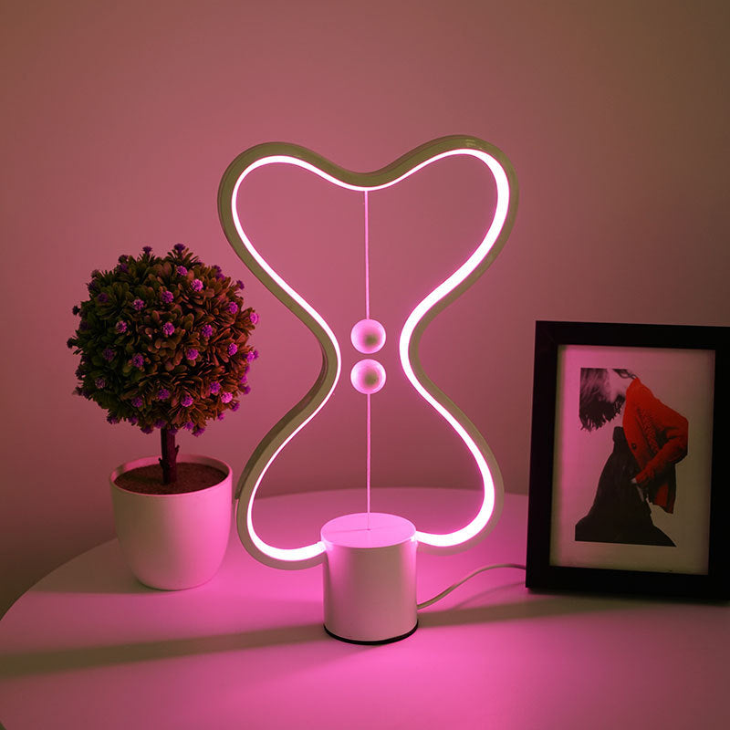 Seven color changing LED light options displayed on a cozy bedroom nightstand