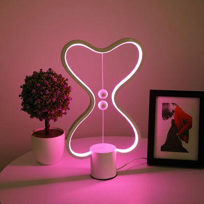 Seven color changing LED light options displayed on a cozy bedroom nightstand