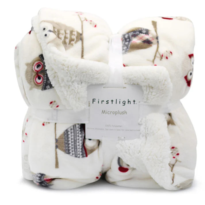 Fleece plush throw blanket styled on bed