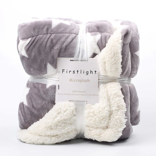 Fleece plush throw blanket folded in gray star pattern