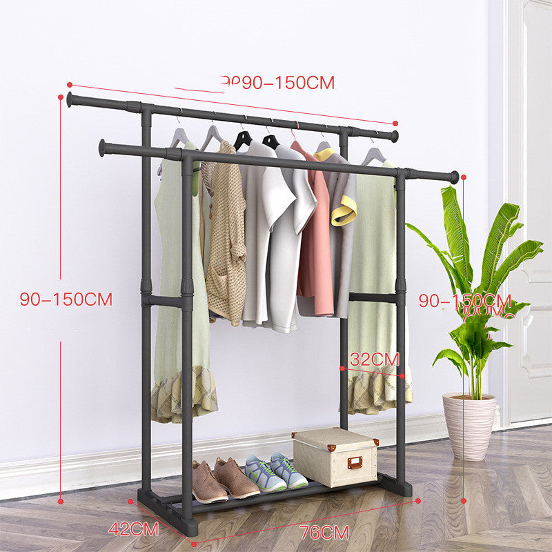 Floor drying rack with clothes hanging and shoes on bottom shelf