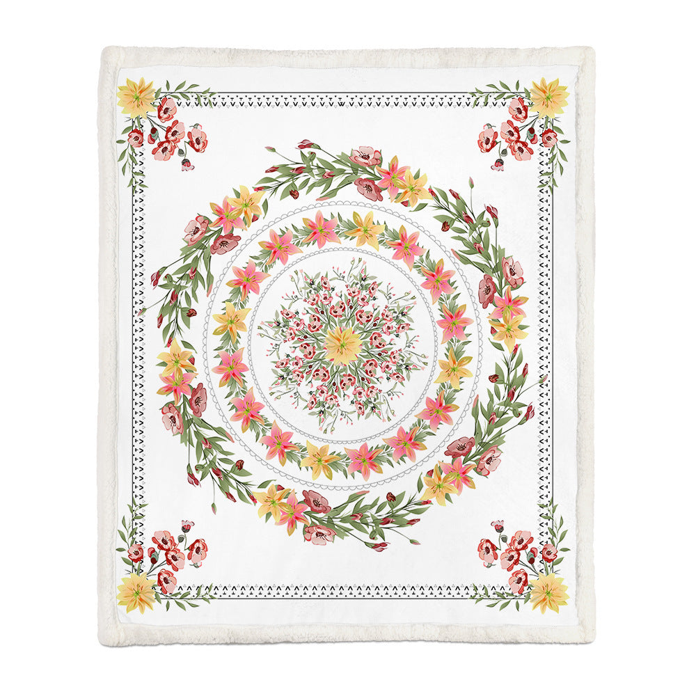 Botanical floral throw blanket neatly folded over a sofa arm as a decorative accent
