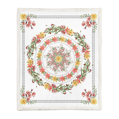 Botanical floral throw blanket neatly folded over a sofa arm as a decorative accent
