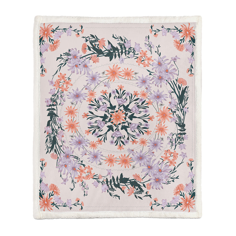 Small size botanical floral blanket folded over a white armchair armrest in a reading corner
