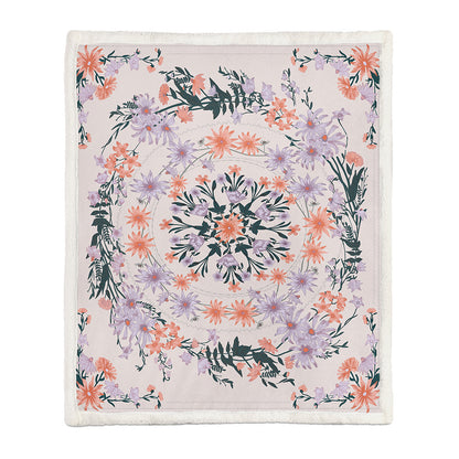 Small size botanical floral blanket folded over a white armchair armrest in a reading corner
