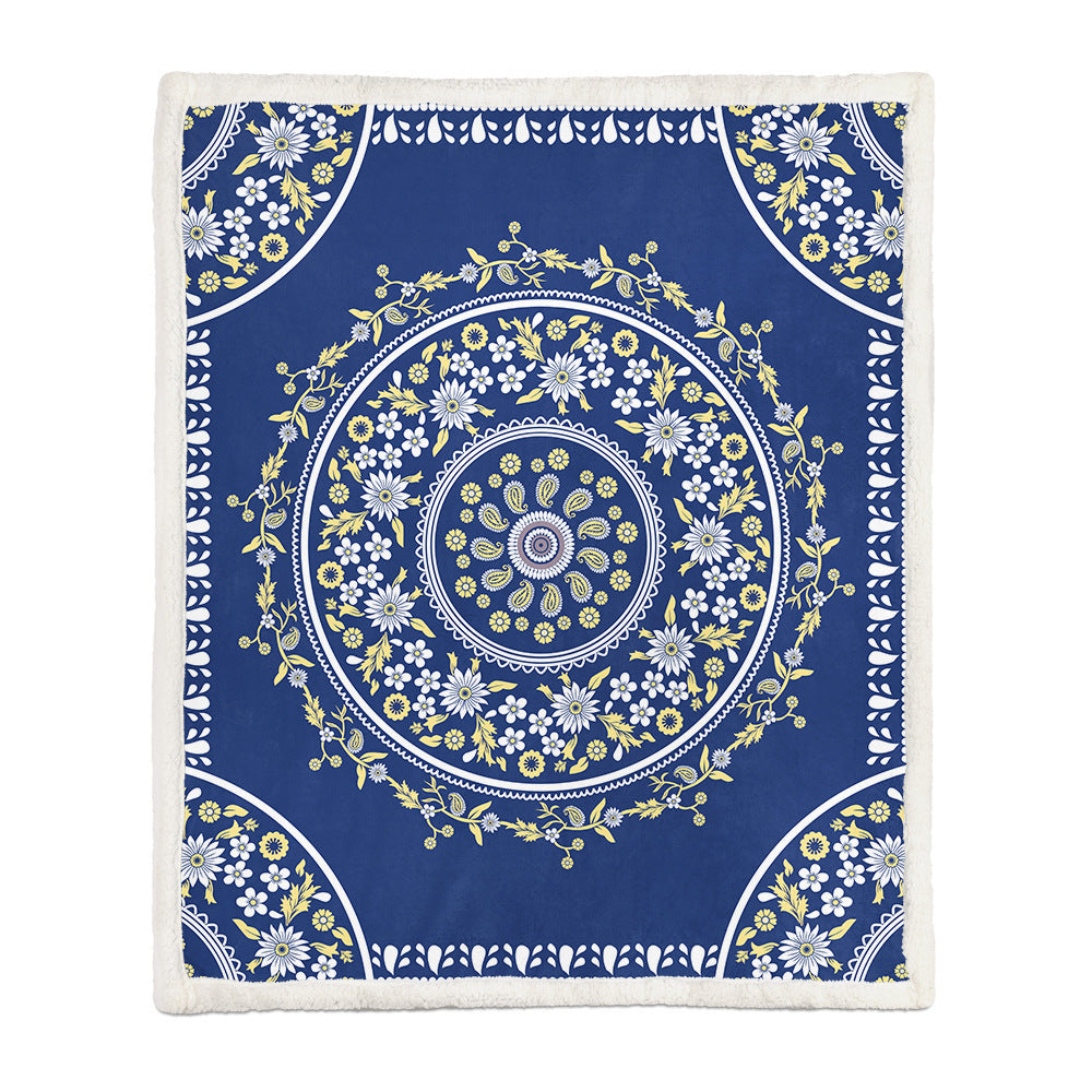 Small size floral throw blanket used as a lap blanket on an armchair covering waist to shin
