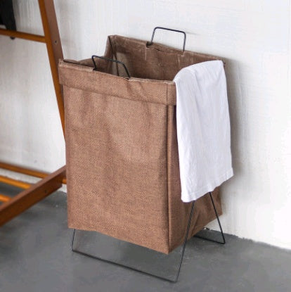 Large foldable fabric laundry hamper standing open in a bathroom corner beside a shower
