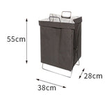 Foldable laundry hamper popping open showing the structural frame holding it upright