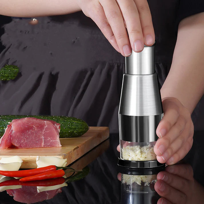 Manual garlic press chopper with fresh garlic cloves